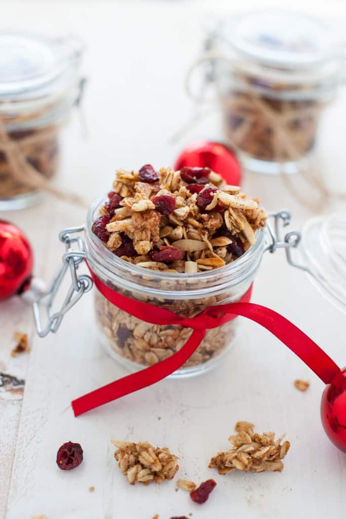 Looking for some last minute holiday DIY food gifts? This holiday cranberry orange granola is festive and flavorful and packs perfectly into mason jars for gifts.