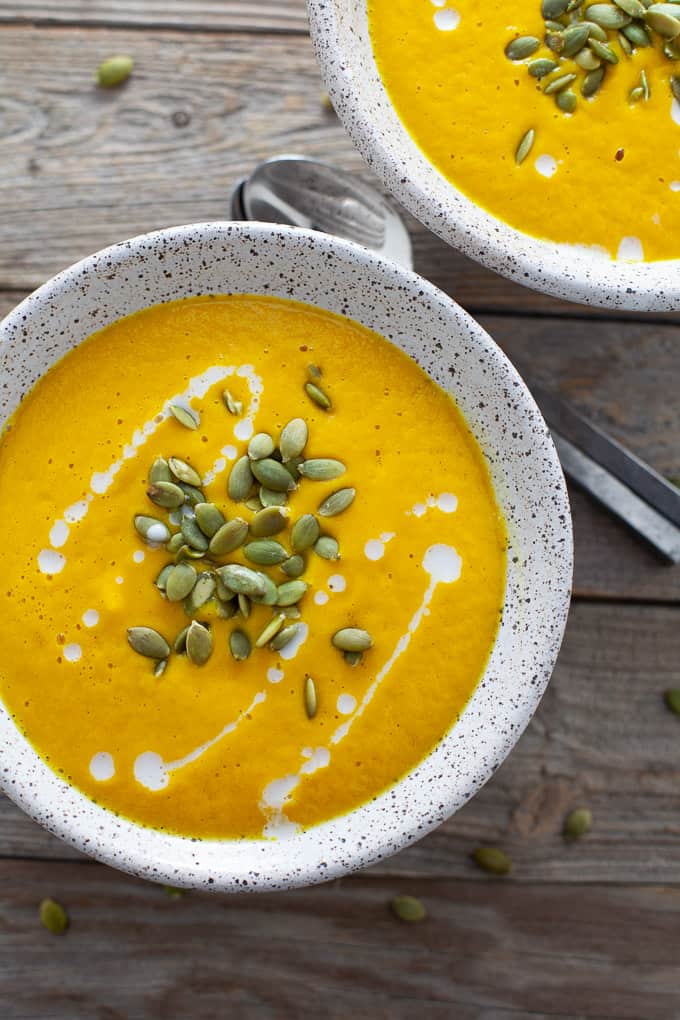 The perfect starter for the holidays, this vegan spiced roasted butternut squash soup is super creamy and has a hint of warming spice from cardamom. Easy to make in a high-speed blender or on the stove-top! #butternutsqaush #vegan #soup #thanksgiving