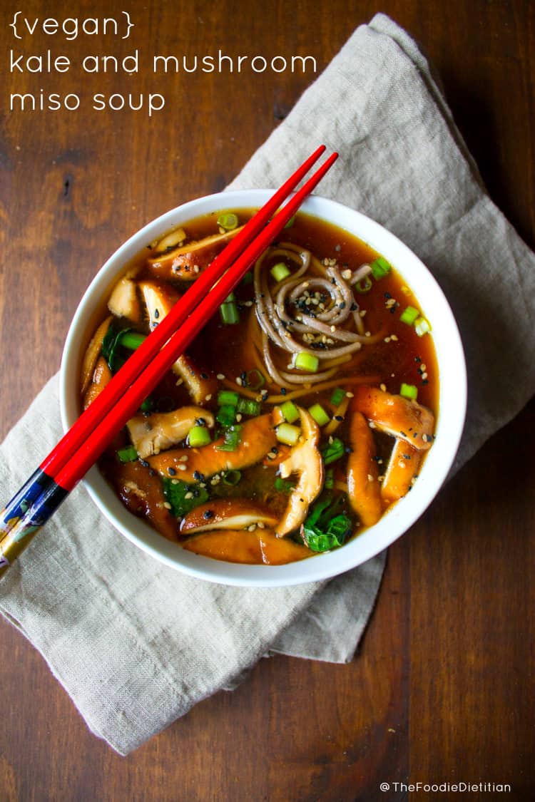 Packed with immune-boosting functional foods like miso, ginger, and mushrooms, this vegan kale and mushroom miso soup is one not to miss during the winter months. | @TheFoodieDietitian