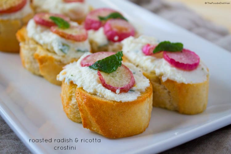 An appetizer to wet your spring appetite - creamy, refreshing ricotta infused with lemon and mint and topped with sweet roasted radishes. | @TheFoodieDietitian