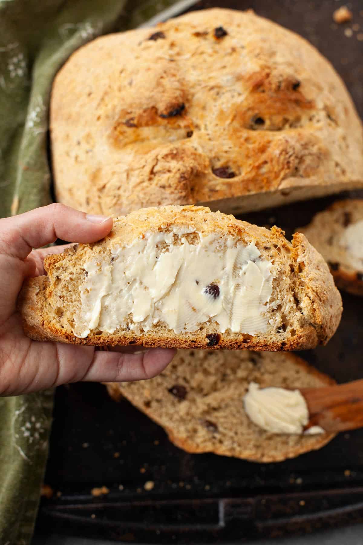 slice of homemade Irish soda bread with butter