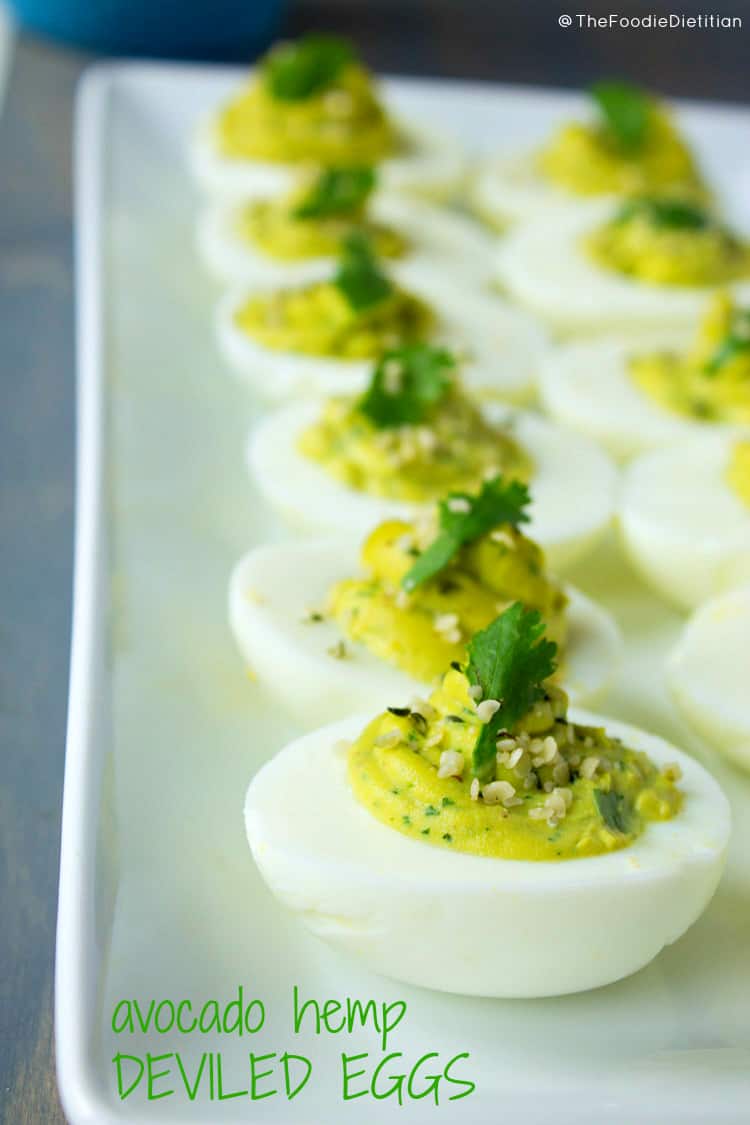 Spice up your regular ol' deviled eggs this Easter with avocado hemp deviled eggs - packed with avocado, lime, cilantro, and hemp oil. | @TheFoodieDietitian