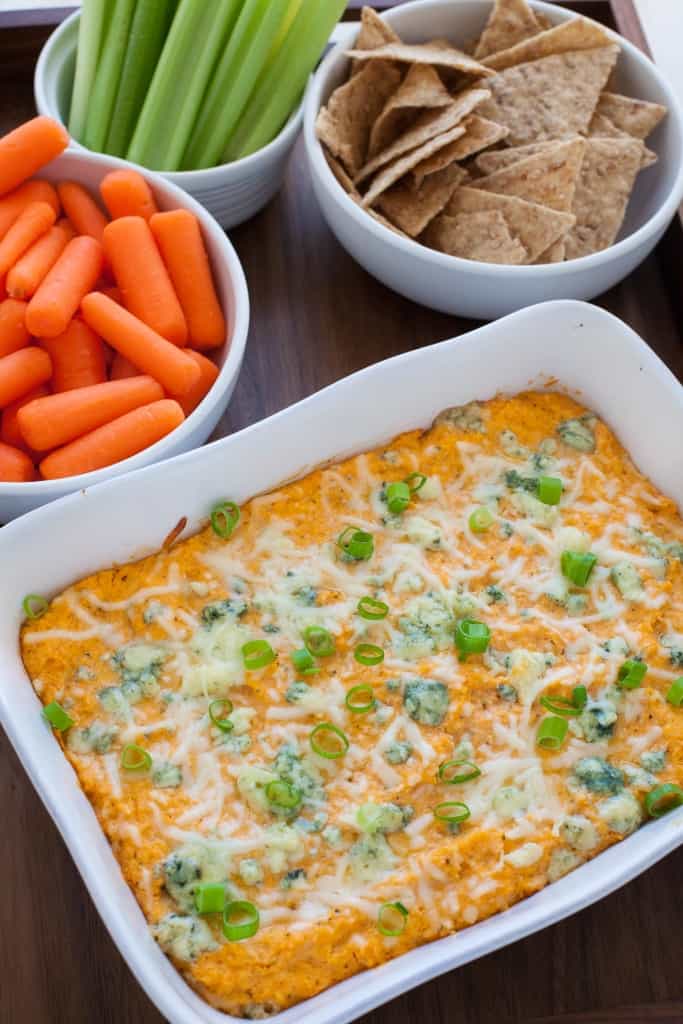 buffalo cauliflower wing dip served with chips and veggies