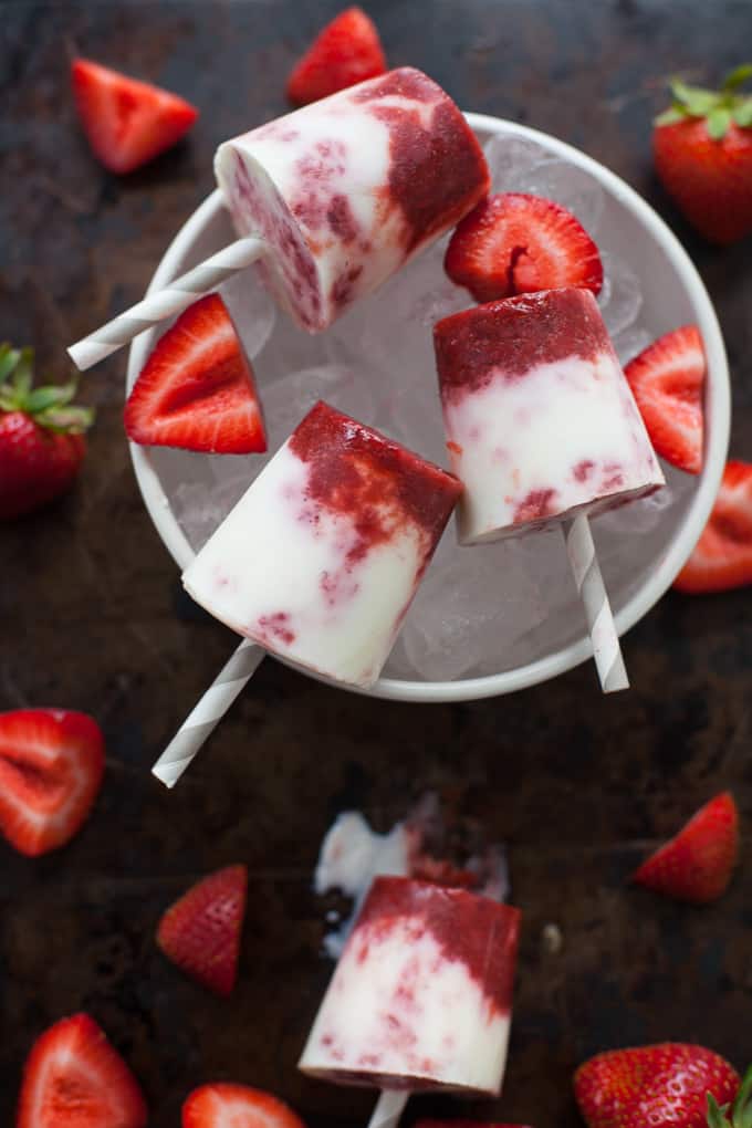 mini balsamic and strawberry cream pops on top of ice, fresh strawberries on the side