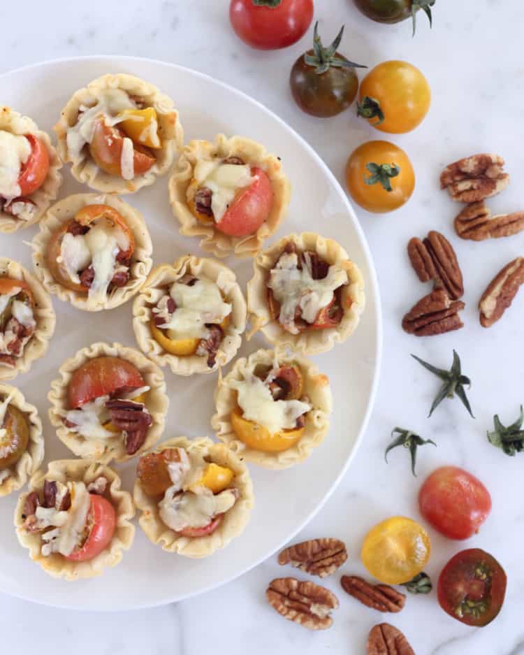 A quick and easy, 7-ingredient appetizer, these tomato pie bites are the perfect hors d'oeuvres for your next summer party!