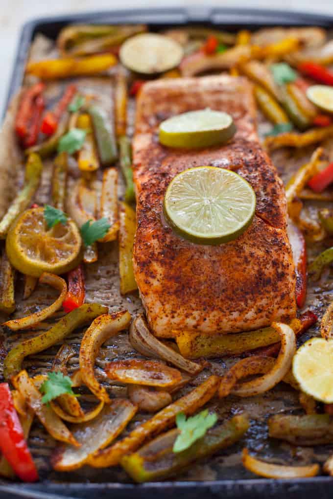 These gluten-free sheet pan salmon fajitas are perfect for a quick weeknight dinner with minimal cleanup! Can you say Taco Tuesday? Or, better yet, Fajita Friday??