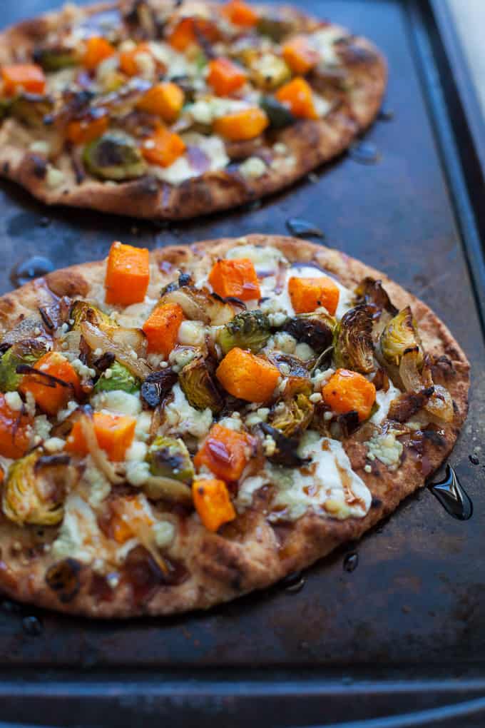 Looking for a quick and easy way to make pizza at home? Try my butternut squash and Brussels sprouts naan pizza! Perfect for a veggie lovers pizza night.