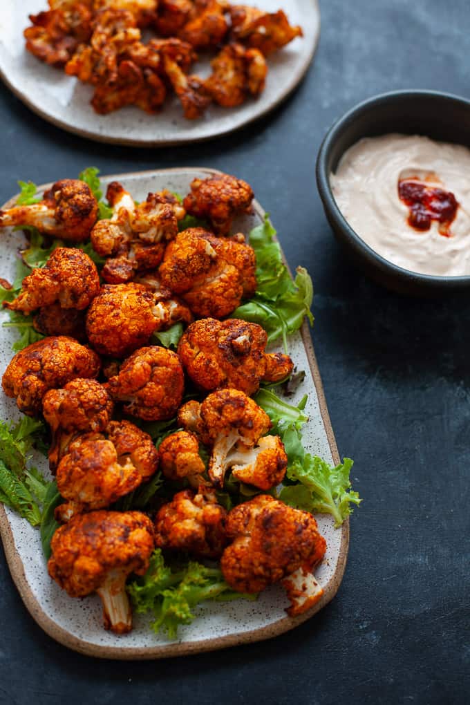 Spicy, smoky and totally satisfying, these harissa cauliflower wings are about to blow your mind. #vegetarian #middleeastern #harissa
