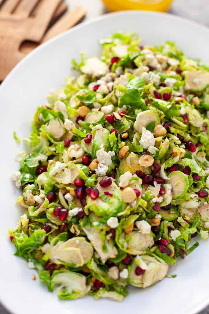 Looking for a festive salad to serve up this holiday season? You and your guests will love my easy and delicious shaved Brussels sprout salad with pomegranate with a citrus vinaigrette. 