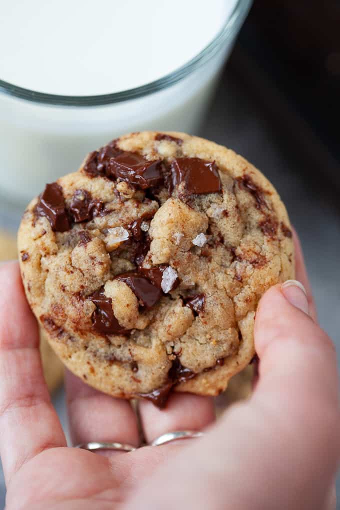 Crispy on the outside, chewy on the inside and oh-so-chocolatey. These chocolate chunk tahini cookies are everything you'd want in a cookie PLUS the nutty flavor of tahini. #cookies #tahini