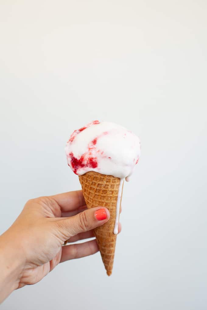 coconut milk strawberry ice cream in a waffle cone
