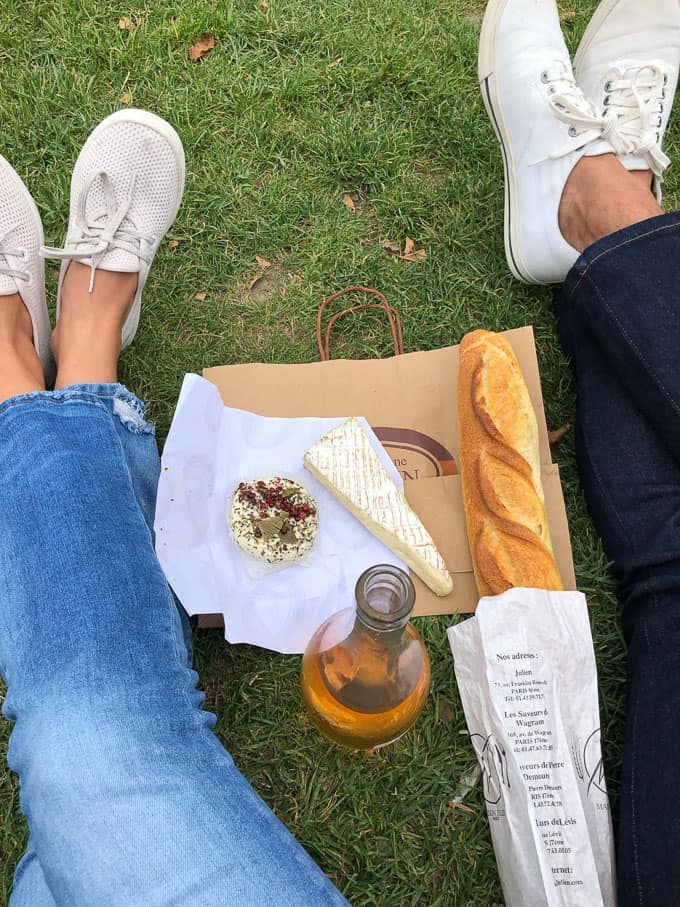 cheese, bread, and a bottle of wine