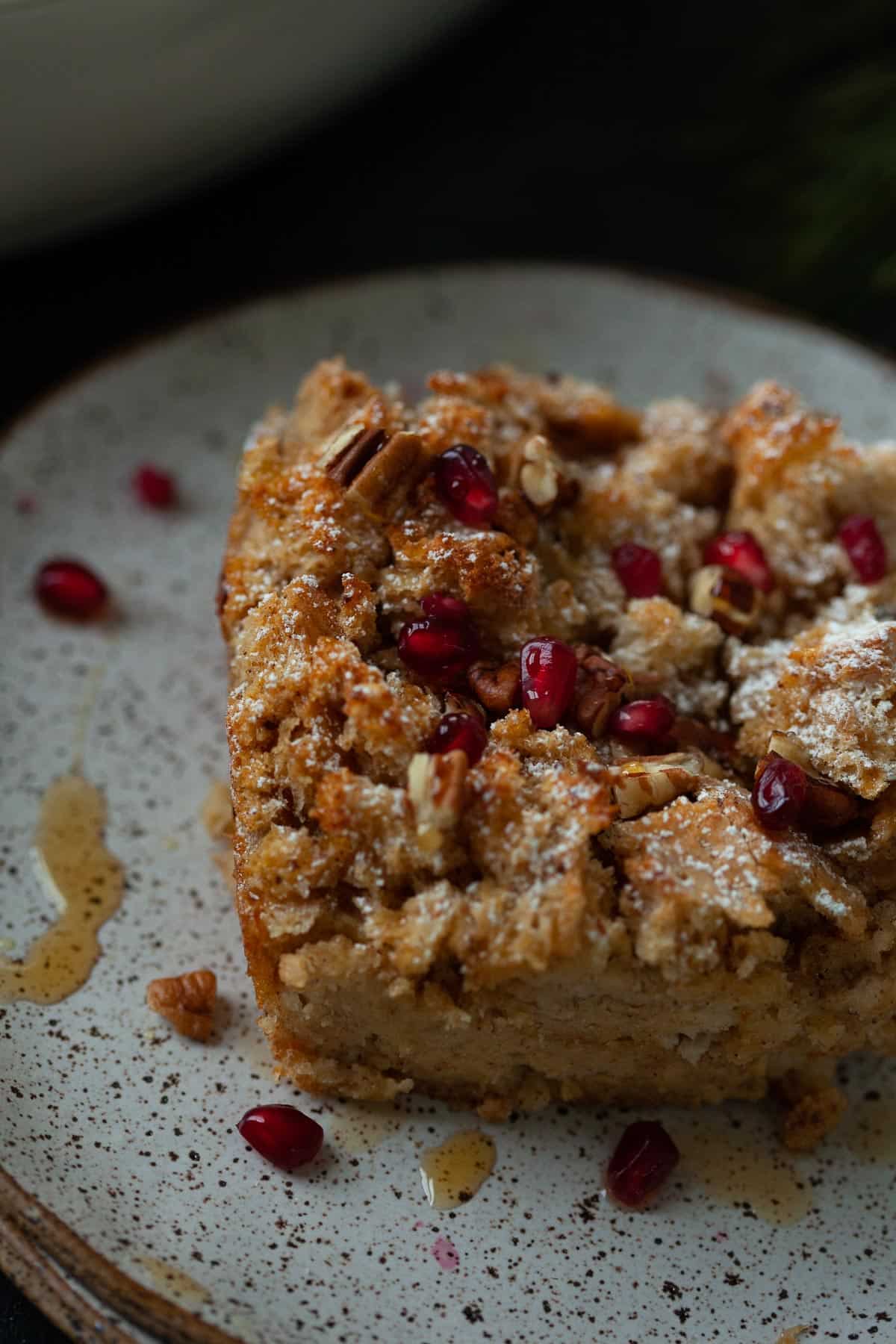 eggnog french toast casserole served with pomegranates and maple syrup