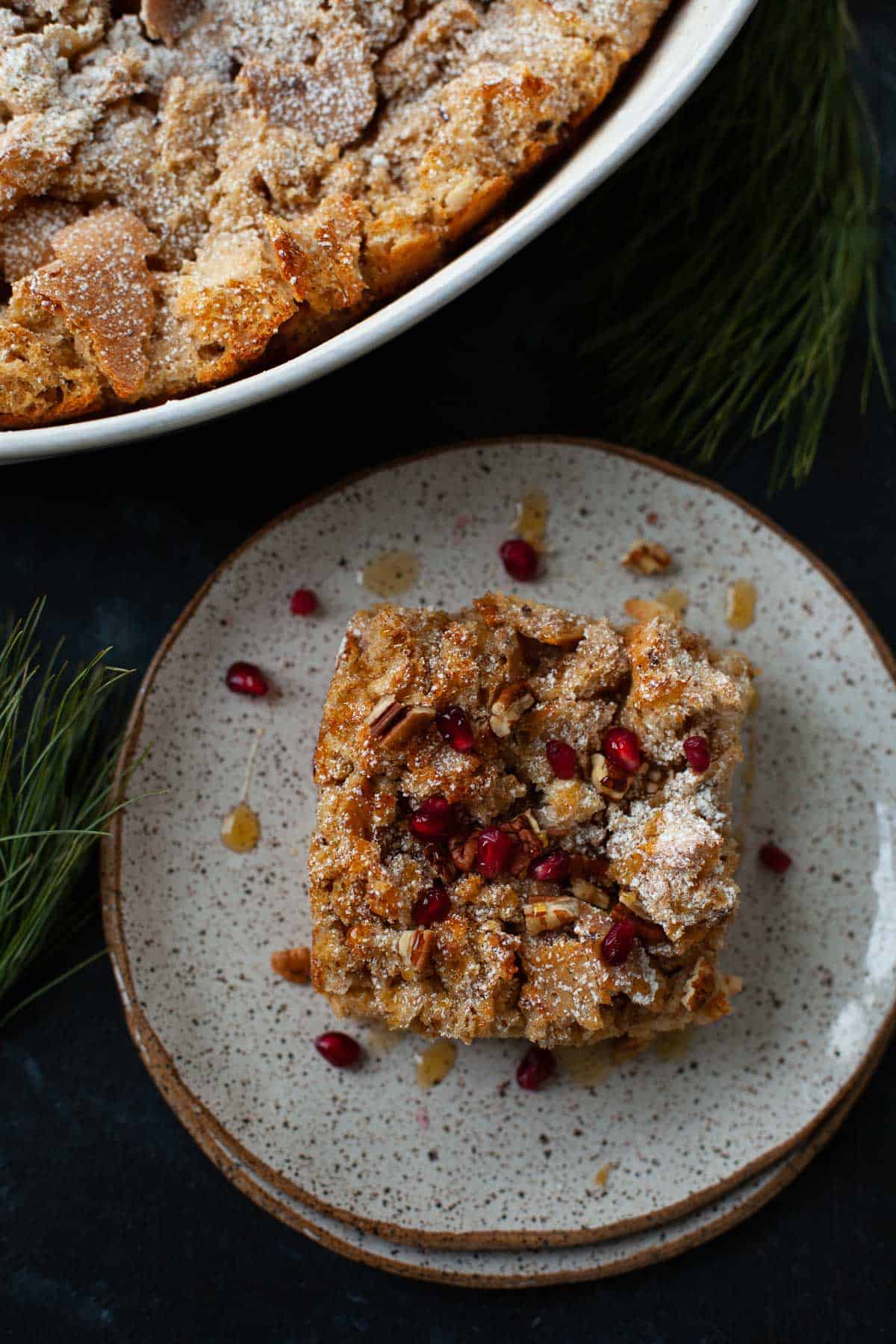 eggnog french toast casserole served with pomegranates and maple syrup