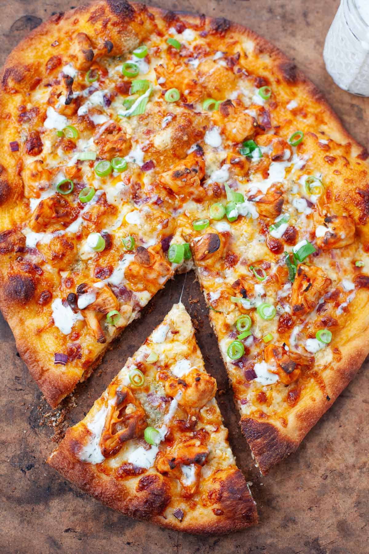 Slice of buffalo cauliflower pizza