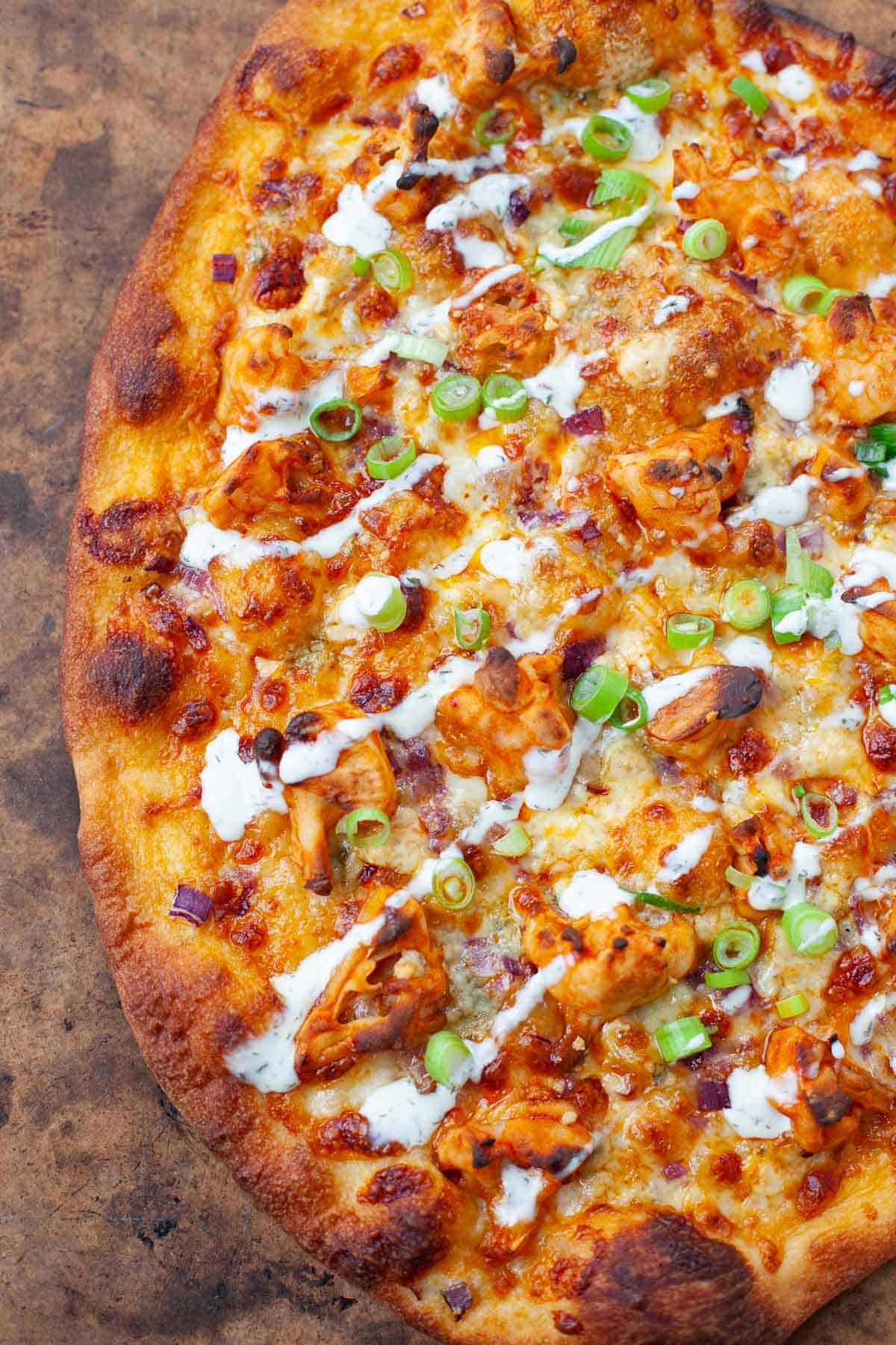 Buffalo cauliflower pizza served fresh out of the oven