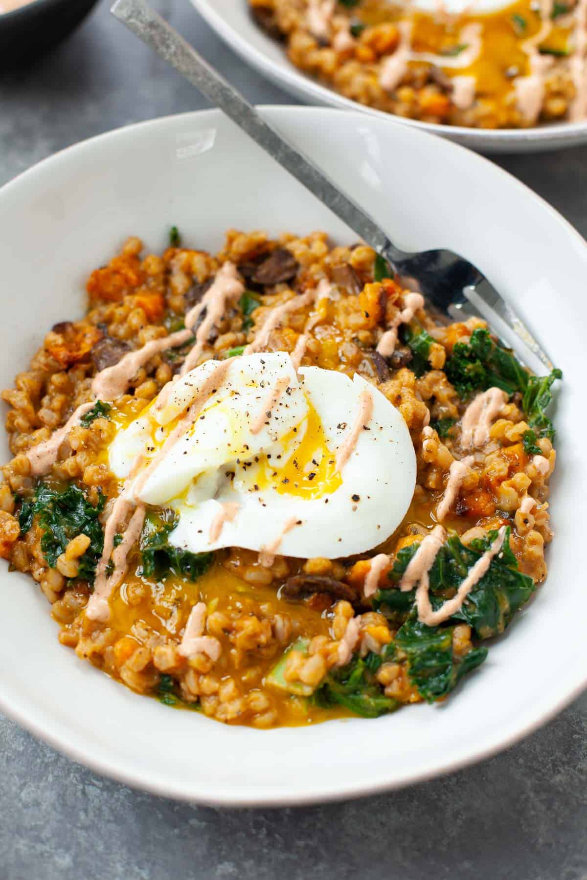 vegetarian farro breakfast bowl with poached egg