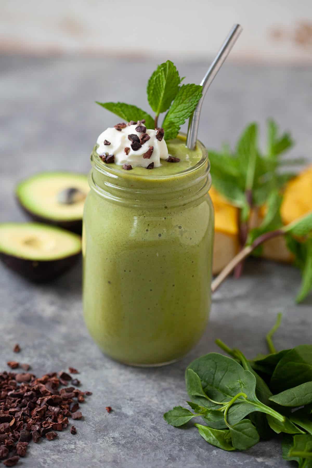 shamrock shake smoothie with whipped topping and cacao nibs for garnish