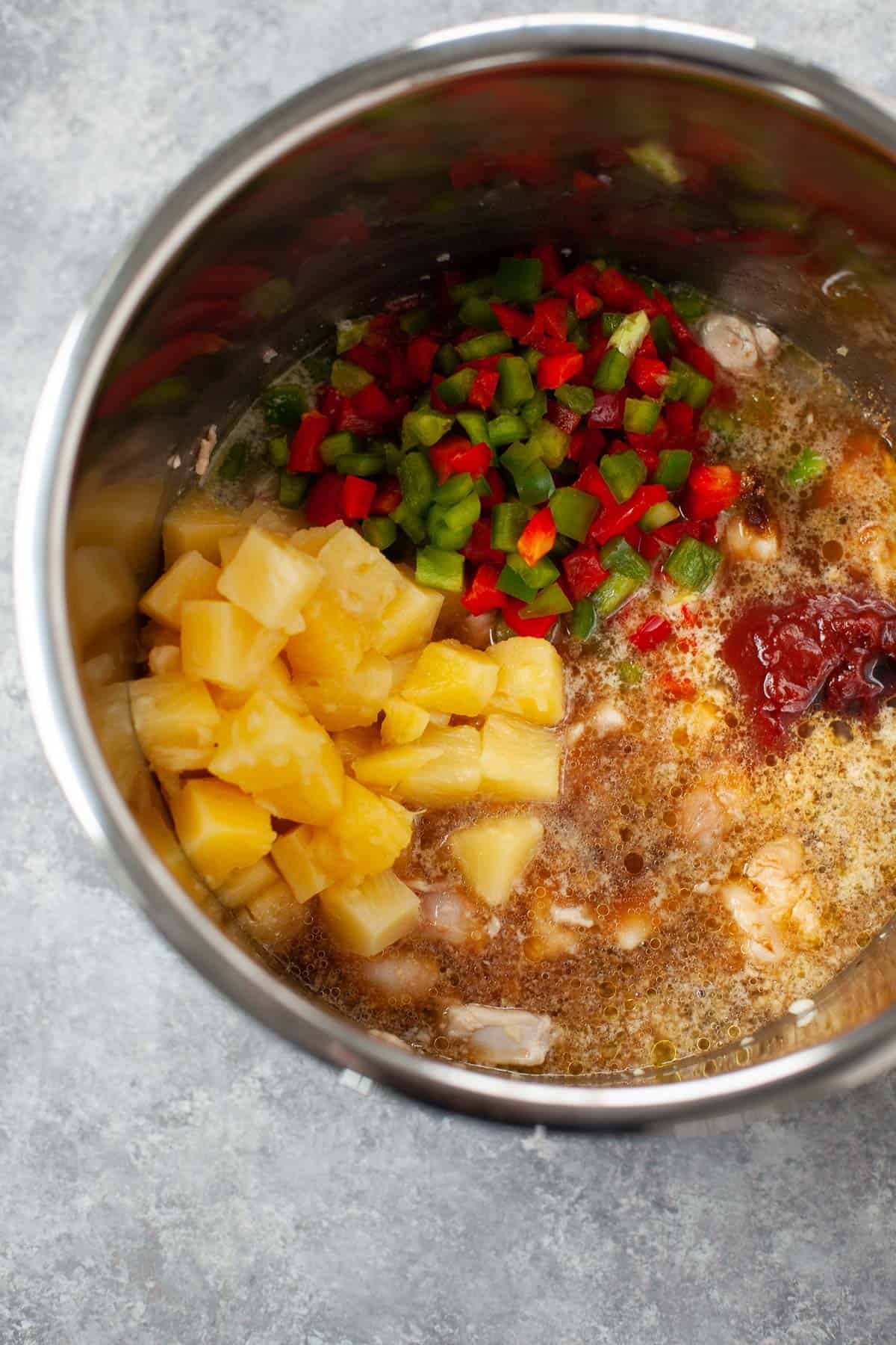ingredients for sweet and sour chicken placed in an instant pot