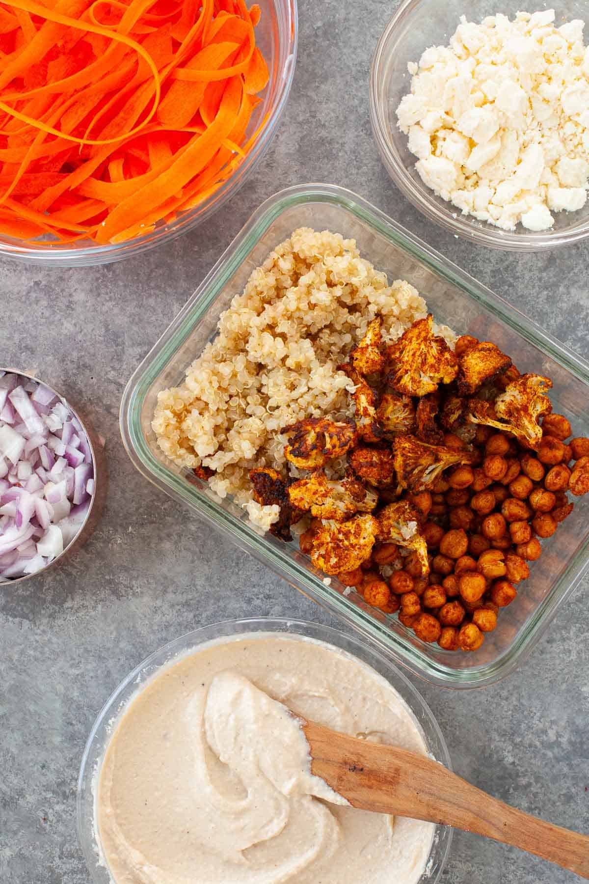 chickpeas, quinoa, and cauliflower placed in a glass container