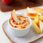 peanut butter apple dip on a place with sliced apples