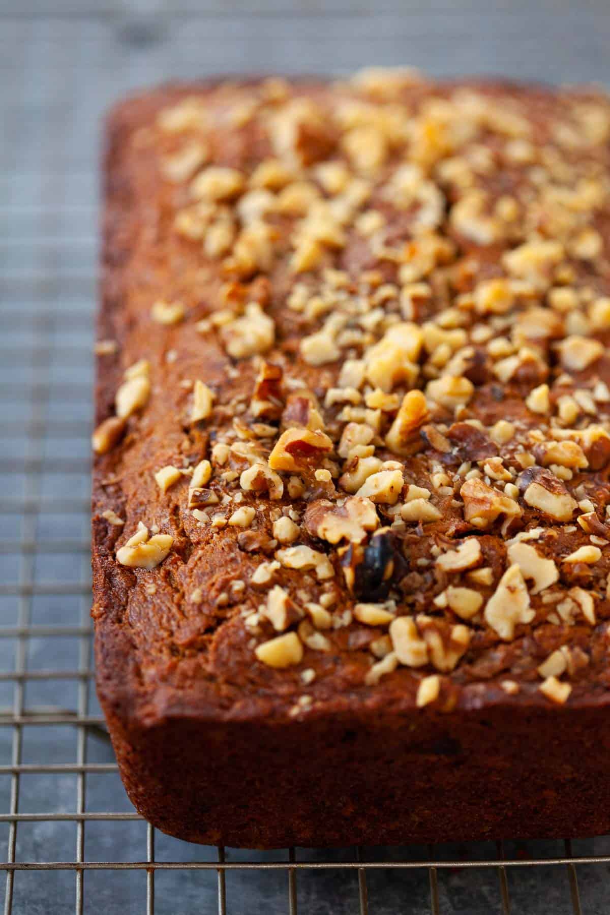 Whole Wheat Butternut Squash Banana Bread with walnuts placed on a cooling rack