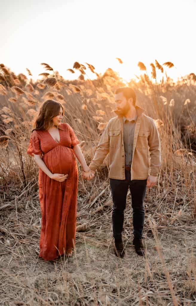 3rd trimester recap and recommendations kara lydon nutrition pregnancy photoshoot red dress holding hands new hampshire