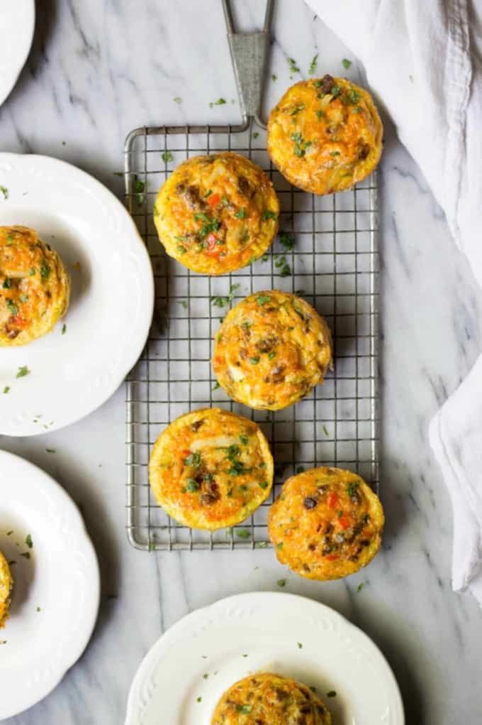 Chorizo and hash brown egg muffins on silver cooling sheet