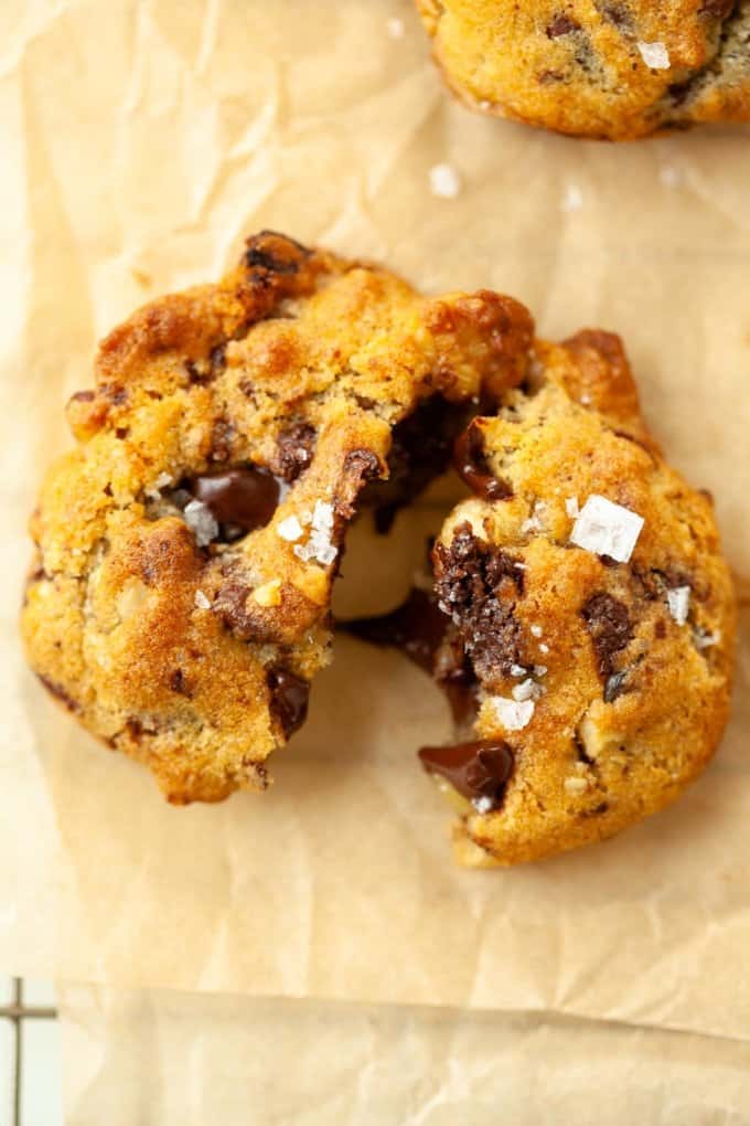 chocolate chip cookie torn in half, gooey chocolate, sea salt