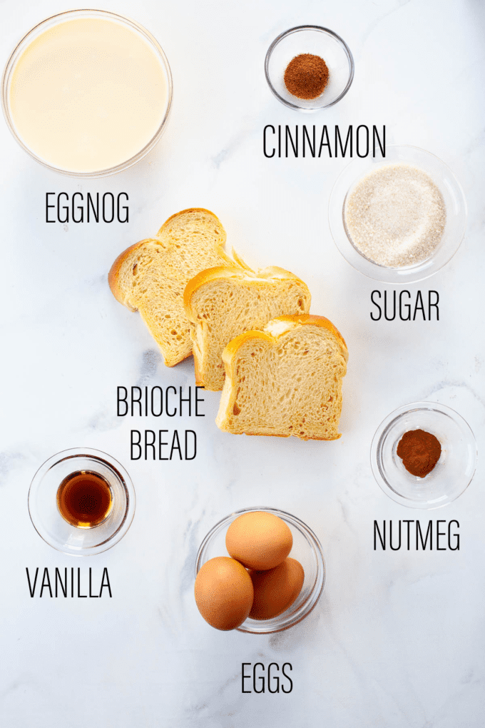 eggnog bread pudding ingredients listed over white marbled background