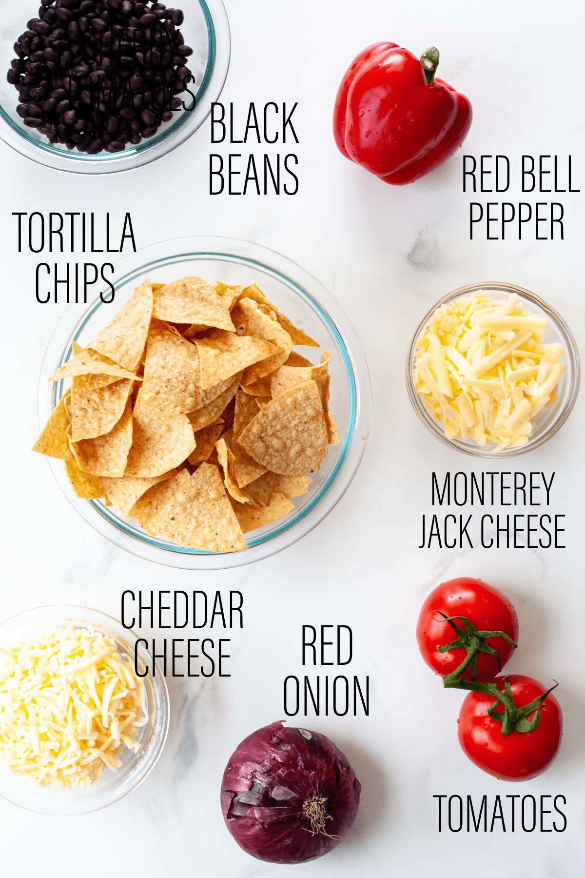 graphic showing ingredients for vegetarian nachos with text overlay on marble background